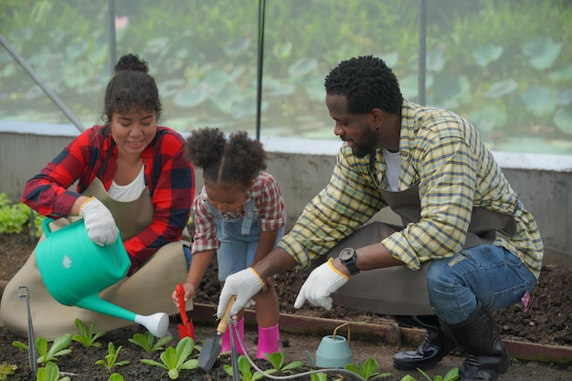 Mother and daughter making outdoor activities at garden diverse\
family happy motherhood weekend together with kid mother\'s day\
concept