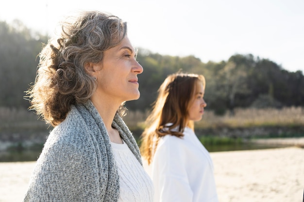 mother and daughter outdoors on the beach together
