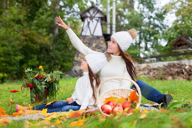 Mother and daughter in the Park in autumn