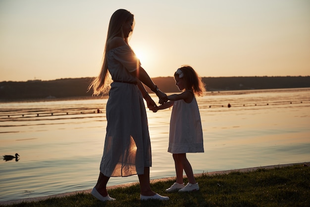 Mother and daughter playing outside