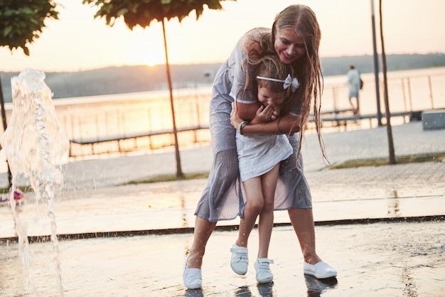 Mother and daughter playing outside