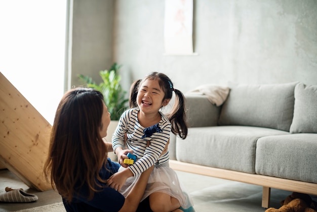 Mother and daughter playing together