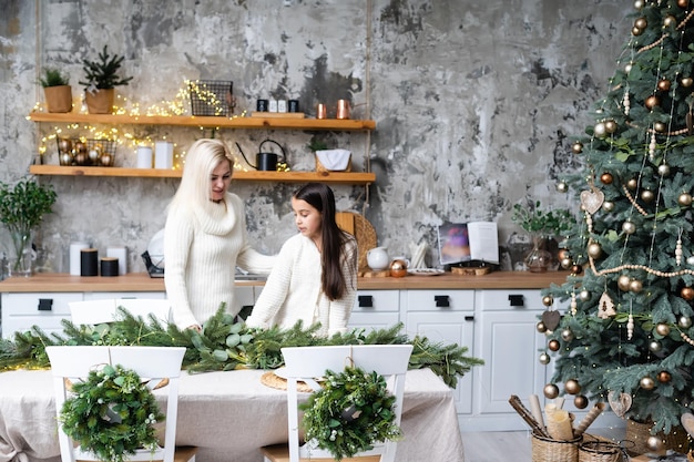 mother and daughter preparing for the christmas.