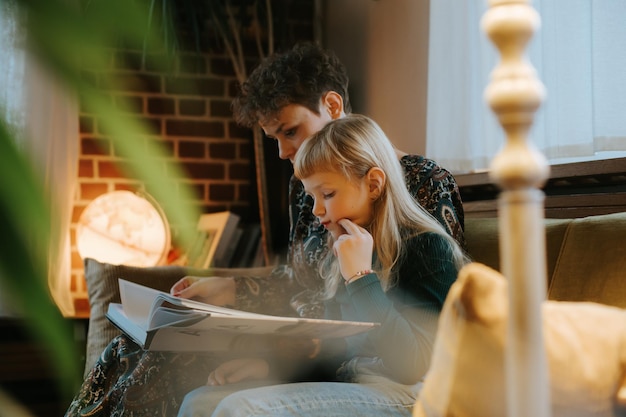 mother and daughter reading a book together
