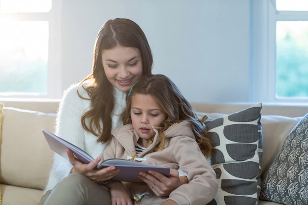 Mother and daughter reading a book