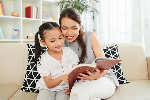 Mother and daughter reading a book