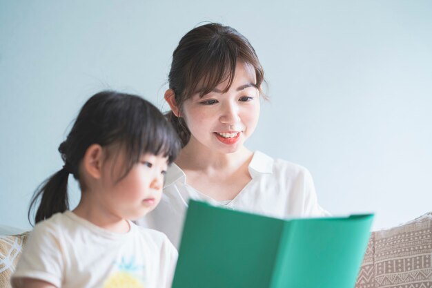 Mother and daughter reading a picture book