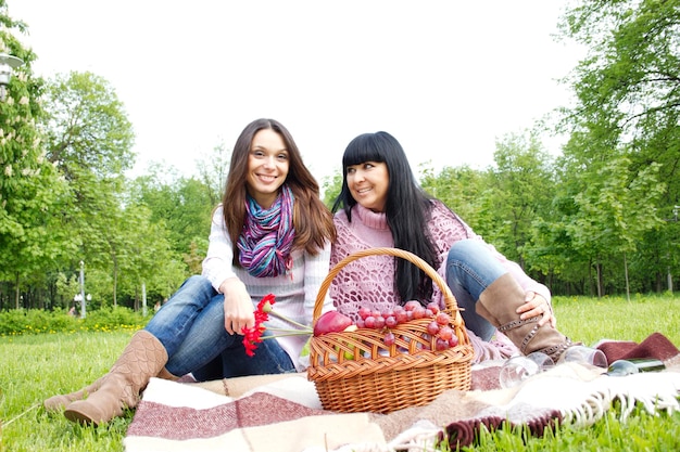 Mother and daughter relaxing outdoors