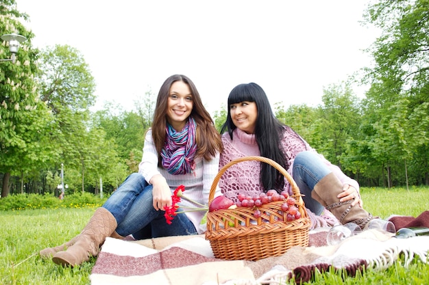 Mother and daughter relaxing outdoors