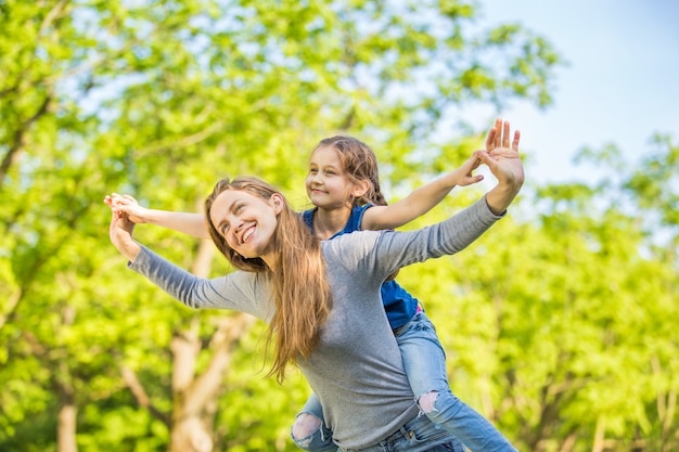 Mother and daughter resting in a park