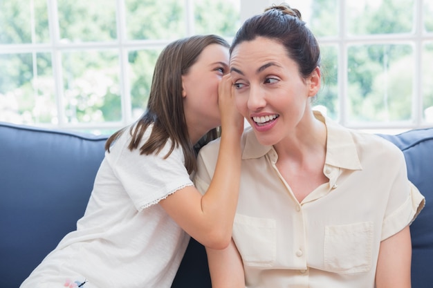 Mother and daughter sharing secrets