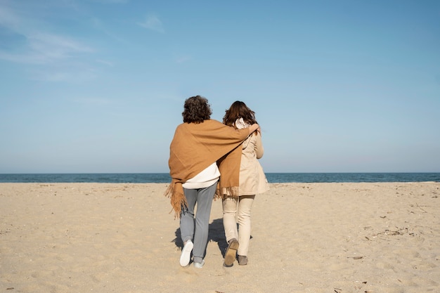 Mother and daughter spending time together at the beach