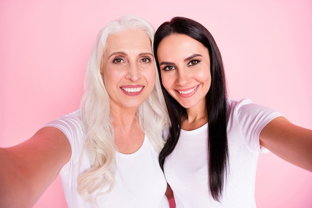 mother and daughter taking selfie