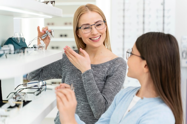 Mother and daughter trying on glasses