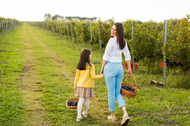 Mother and daughter in vineyard