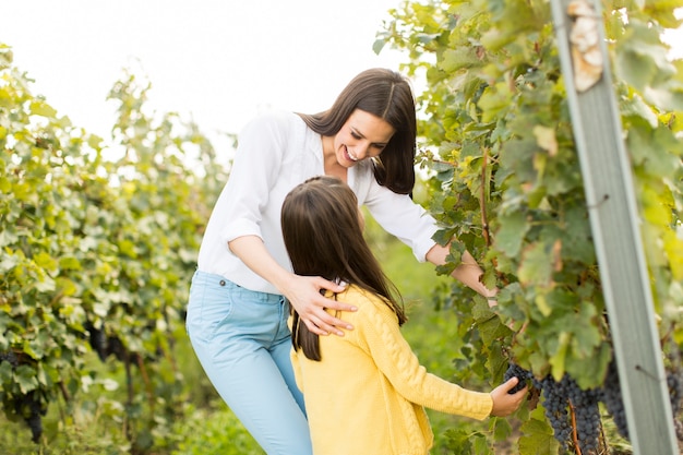 Mother and daughter in vineyard