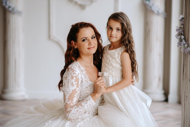 mother and daughter in wedding dresses
