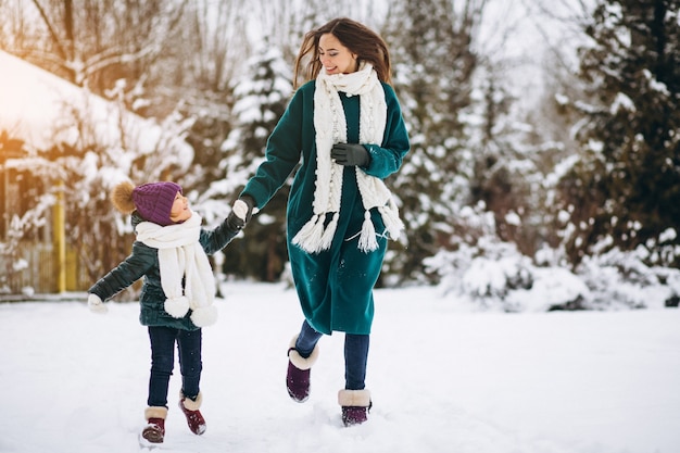 Mother and daughter in winter park