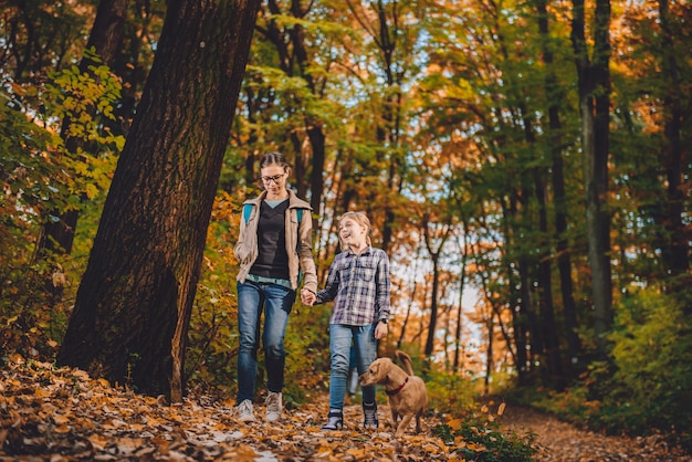 Mother and daughter with dog hiking