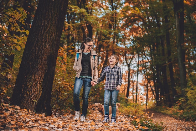 Mother and daughter with dog hiking