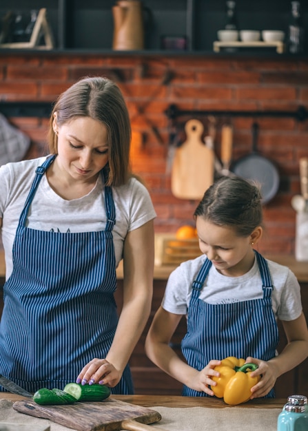 Mother and daughter with veegtables