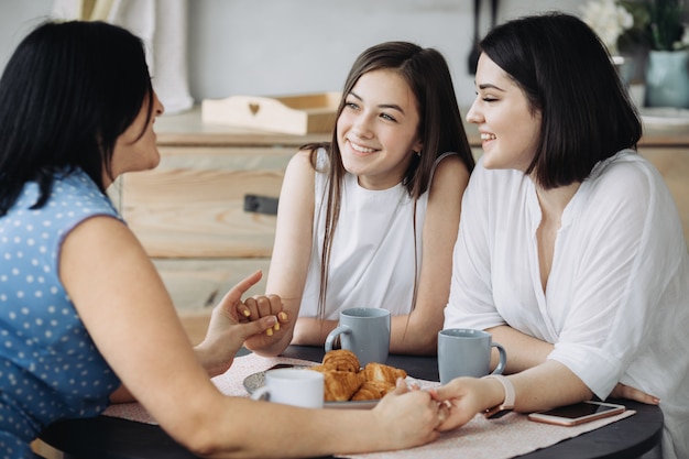 Mother and daughters having fun together