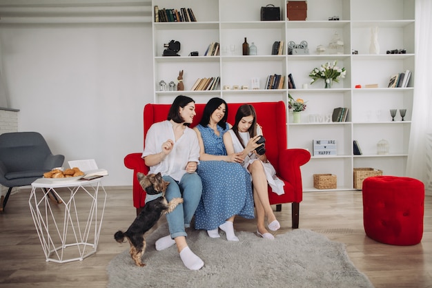 Mother and daughters resting in the living room