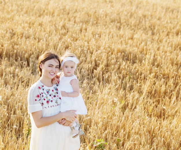 Mother and daugther in field