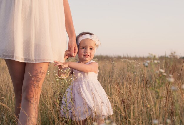 Mother and daugther at sunset