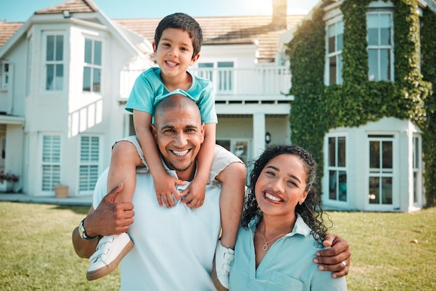 Mother father and child outdoor as family in backyard of house with a smile love and care Man woman and boy kid with parents for portrait security and quality time insurer with happiness