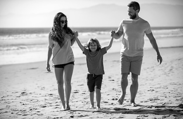 mother father and child son spending time together family summer vacation parent dad mom walking