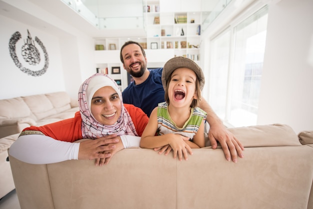 Mother father and son as a happy family at home