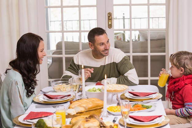 Mother father and son during christmas dinner