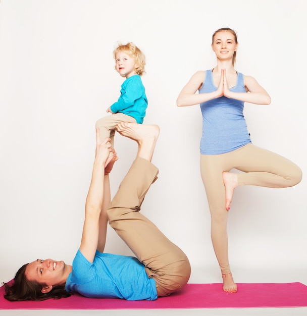 Mother father and son doing yoga