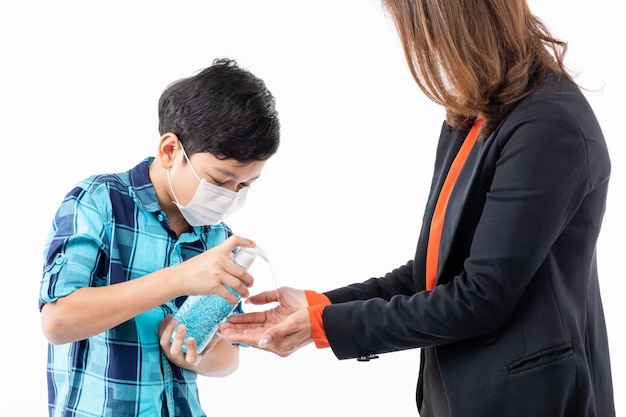 Mother give hand wash gel to son