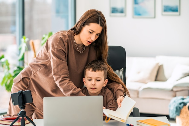 Mother helps son with online education