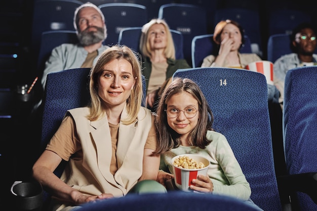 Mother and her daughter at cinema