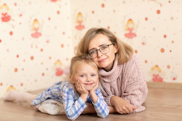 Mother and her daughter playing and hugging