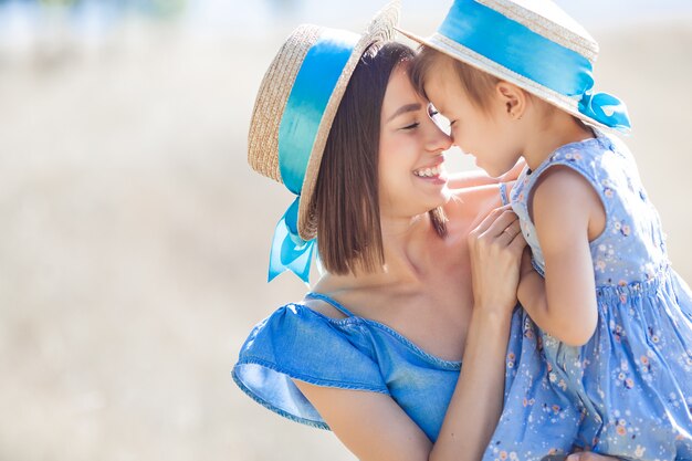 mother and her little daughter having fun outdoors