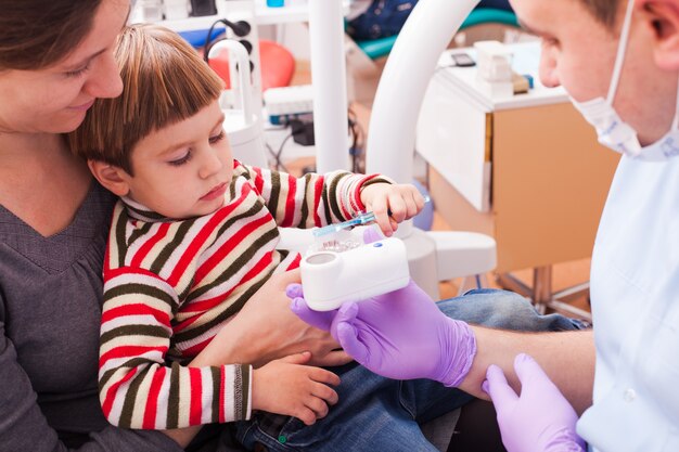 Mother and her son on reception at the dentist