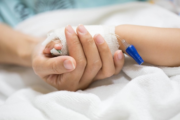 Mother holding a baby hand