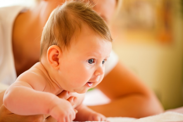 Mother holding Baby in hand