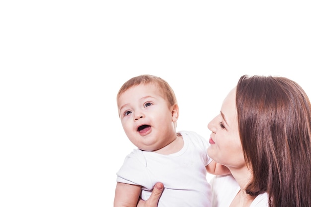 Mother holding her baby in her arms, white background