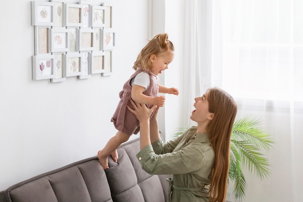 mother holding little child