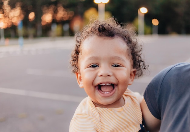 Mother holding mixed race son