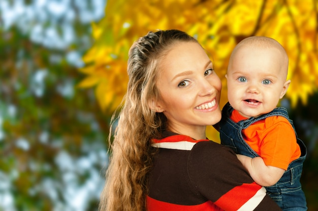 Mother hugging her child during walk in the park