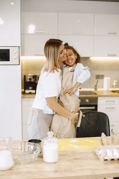 Mother hugging her daughter