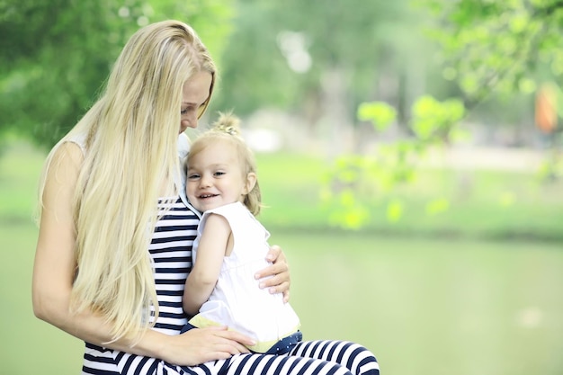 Mother hugging little daughter portrait