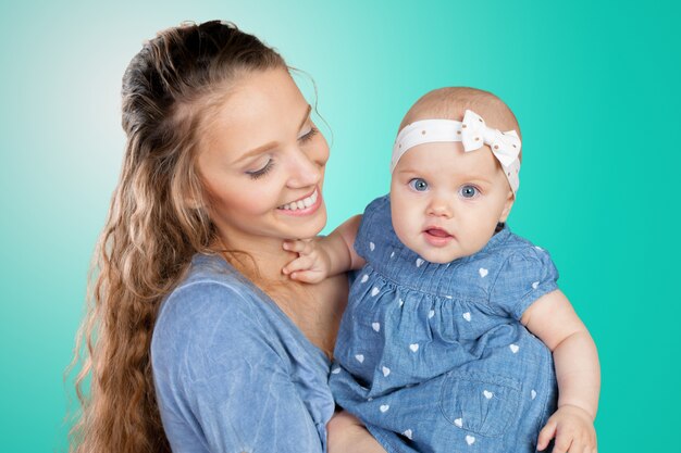 Mother hugs a young child