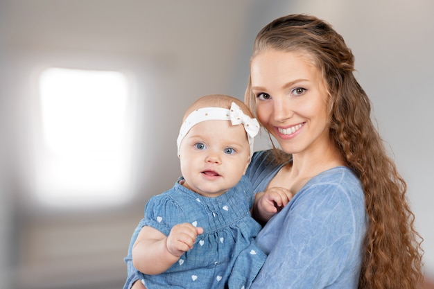 Mother hugs a young child